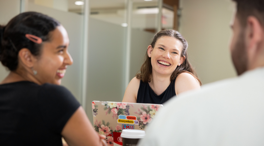 Three LMU students study together on LMU's campus